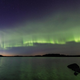 The auroral “dunes,” which appear as undulating green waves.
